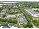 Expansive aerial shot showcasing a neighborhood with beautiful landscaping and community buildings at 1845 Common Way Rd # 28-206, Orlando, FL 32814