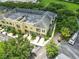 Aerial view of a multi-Gathering residential area with well-maintained townhomes and lush landscaping at 1845 Common Way Rd # 28-206, Orlando, FL 32814