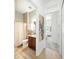 Cozy bathroom featuring warm wooden cabinets and neutral decor at 1845 Common Way Rd # 28-206, Orlando, FL 32814