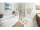 Bright bathroom with large tub and glass enclosed shower at 1845 Common Way Rd # 28-206, Orlando, FL 32814