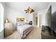 Bedroom with ceiling fan, tv and and modern decor at 1845 Common Way Rd # 28-206, Orlando, FL 32814