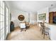 Dining room area adjacent to kitchen, flooded with natural light from the french doors at 1845 Common Way Rd # 28-206, Orlando, FL 32814