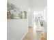 Hallway with white walls and trim with lots of natural light at 1845 Common Way Rd # 28-206, Orlando, FL 32814