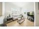 Cozy living room bathed in natural light with neutral color palette and modern furnishings at 1845 Common Way Rd # 28-206, Orlando, FL 32814