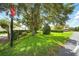 Quiet neighborhood street with lush greenery and sidewalk at 1845 Common Way Rd # 28-206, Orlando, FL 32814