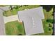 Aerial view of home showcasing roof, skylights, driveway, and verdant landscaping at 1889 Eden Dr, Deltona, FL 32725
