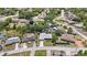 Neighborhood aerial view showcasing the home's location on a tree-lined street at 1889 Eden Dr, Deltona, FL 32725