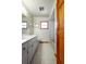 Bathroom featuring a white double vanity and a bathtub shower combination at 1889 Eden Dr, Deltona, FL 32725