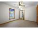 Bedroom with carpet, closet with mirror doors, a window, and a ceiling fan at 1889 Eden Dr, Deltona, FL 32725