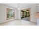 Bright dining area featuring tile floors, sliding glass doors, and a window with natural light at 1889 Eden Dr, Deltona, FL 32725
