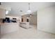 Bright kitchen features white cabinetry, tile floors, and an island with ample countertop space at 1889 Eden Dr, Deltona, FL 32725