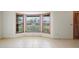 Bright living area featuring tile floors and a charming bay window that provides plenty of natural light at 1889 Eden Dr, Deltona, FL 32725