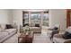 Inviting living room with comfortable seating, a bay window, and a neutral color palette at 1889 Eden Dr, Deltona, FL 32725