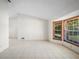 Open living area with tile flooring and two windows allowing plenty of natural light at 1889 Eden Dr, Deltona, FL 32725