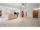 Bright and airy living space showcasing open floor plan with tile floors and natural light at 1889 Eden Dr, Deltona, FL 32725
