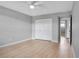 This bedroom features new wood laminate flooring, a ceiling fan and a closet at 2901 N Halifax Ave # 220, Daytona Beach, FL 32118