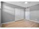 This bedroom features new wood laminate flooring, a ceiling fan and a closet at 2901 N Halifax Ave # 220, Daytona Beach, FL 32118