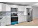 The kitchen has white cabinets, stainless appliances, and plenty of countertop space at 2901 N Halifax Ave # 220, Daytona Beach, FL 32118