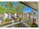 Scenic balcony view of a well-maintained courtyard with lush landscaping and residential buildings at 2912 Plaza Terrace Dr # 2912, Orlando, FL 32803