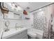 Cozy bathroom featuring decorative tile accents in the shower and a white vanity with stylish mirror and fixtures at 2912 Plaza Terrace Dr # 2912, Orlando, FL 32803