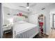 Well-lit bedroom with white furnishings, modern ceiling fan, wood floors, and a closet with sliding doors at 2912 Plaza Terrace Dr # 2912, Orlando, FL 32803