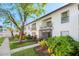White brick building with balconies and well-maintained landscaping for an inviting curb appeal at 2912 Plaza Terrace Dr # 2912, Orlando, FL 32803