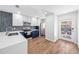 Bright and airy kitchen with blue backsplash, modern lighting, and stainless steel appliances at 2912 Plaza Terrace Dr # 2912, Orlando, FL 32803