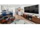 Bright living room with modern furniture and decor, flowing into a dining area and kitchen at 2912 Plaza Terrace Dr # 2912, Orlando, FL 32803