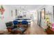 Open concept living space with dining table, Eames chair, and hardwood flooring at 2912 Plaza Terrace Dr # 2912, Orlando, FL 32803