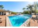 Community pool with lake view, lounge chairs, tables and chairs available on deck at 2912 Plaza Terrace Dr # 2912, Orlando, FL 32803