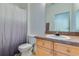 Functional bathroom with a single sink vanity, toilet, and shower, designed for everyday convenience at 305 Terrace Ridge Cir # 305, Davenport, FL 33896