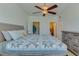 Spacious bedroom featuring a full bed, ample closet space, and ensuite bathroom entrance for convenience and comfort at 305 Terrace Ridge Cir # 305, Davenport, FL 33896