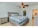 Comfortable bedroom showcasing a platform bed, side table, and closet, with an adjacent bathroom entrance at 305 Terrace Ridge Cir # 305, Davenport, FL 33896