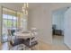 Cozy dining area with white table set and natural light at 305 Terrace Ridge Cir # 305, Davenport, FL 33896
