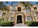 Attractive condo exterior with manicured shrubs and access to multiple units at 305 Terrace Ridge Cir # 305, Davenport, FL 33896