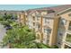 Attractive multi-story condo building with well-maintained landscaping, providing a welcoming and appealing exterior at 305 Terrace Ridge Cir # 305, Davenport, FL 33896