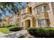 Charming condominium building with well-manicured landscaping and inviting entrance at 305 Terrace Ridge Cir # 305, Davenport, FL 33896