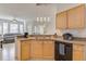 Functional kitchen with stainless steel sink, dishwasher, and ample counter space at 305 Terrace Ridge Cir # 305, Davenport, FL 33896