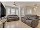 Comfortable living room with plush seating and a ceiling fan at 305 Terrace Ridge Cir # 305, Davenport, FL 33896