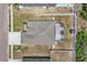Aerial view of the home showcasing the backyard, screened-in patio, and surrounding property at 344 Highland Meadows St, Davenport, FL 33837