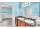 A view of the bathroom with a double vanity at 344 Highland Meadows St, Davenport, FL 33837