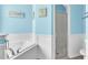 Bathroom with a soaking tub and a glass-enclosed shower at 344 Highland Meadows St, Davenport, FL 33837