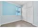 Bedroom with a light blue paint, closet, and wood-style tile flooring at 344 Highland Meadows St, Davenport, FL 33837