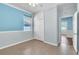 Bedroom featuring wood-style tile flooring, ceiling fan, closet, and natural light from window at 344 Highland Meadows St, Davenport, FL 33837