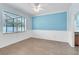 Bedroom featuring tile floors, neutral tones, and a large window with natural light at 344 Highland Meadows St, Davenport, FL 33837