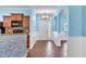 Inviting entryway with wood flooring, contrasting blue and white walls, and open access to the kitchen at 344 Highland Meadows St, Davenport, FL 33837