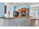 View of the kitchen bar, stainless steel appliances, and mosaic tile backsplash at 344 Highland Meadows St, Davenport, FL 33837