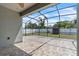 A screened patio with tiled flooring at 344 Highland Meadows St, Davenport, FL 33837