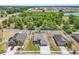 Street-level view of three homes, showcasing their landscaping and proximity to each other at 344 Highland Meadows St, Davenport, FL 33837
