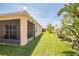 Expansive backyard featuring lush greenery and a screened lanai at 3679 Julius Estates Blvd, Winter Haven, FL 33881